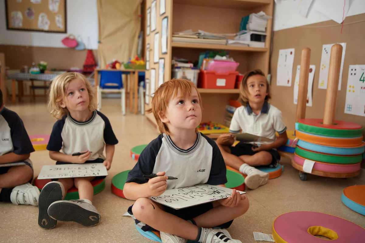 Three children drawing 
