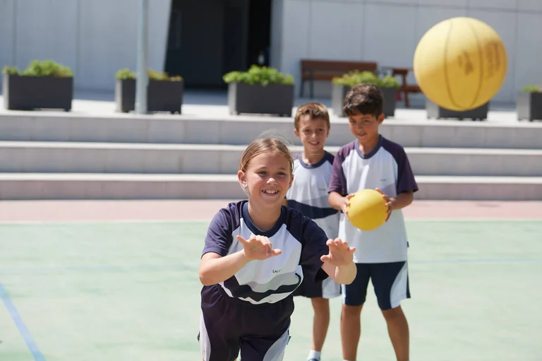 Student throwing a ball