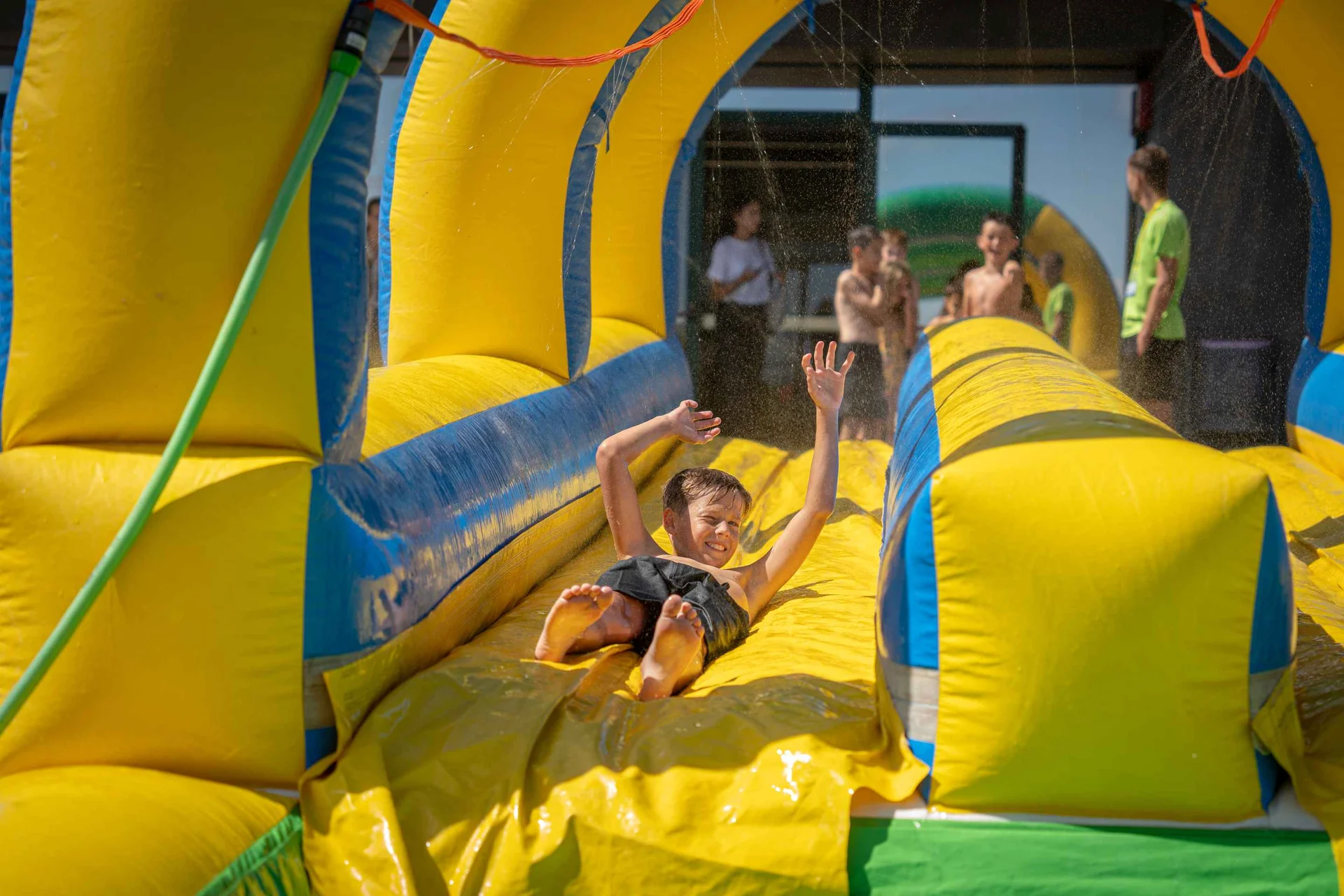 Student on an inflatable slide