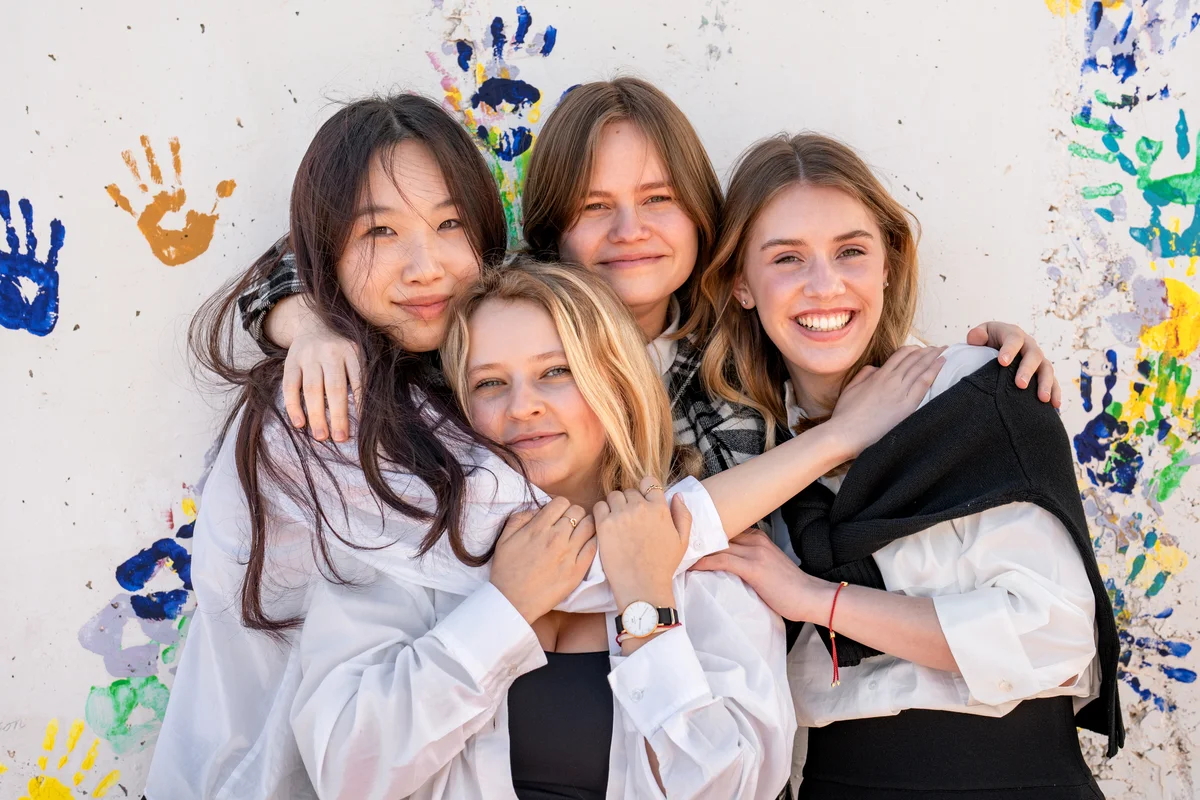 Four girls hugging each other