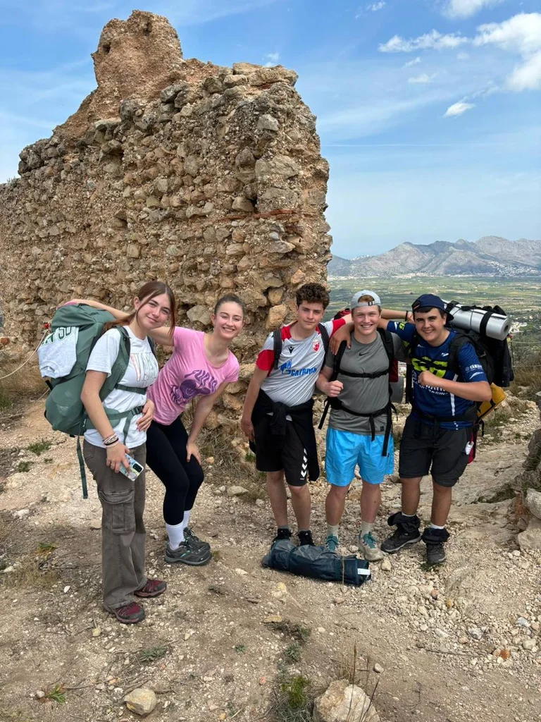 students on top of a mountain